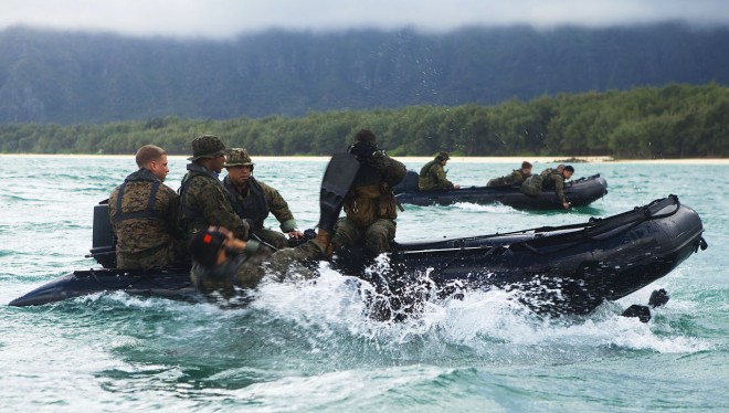 Force Reconnaissance Marines slide off F470 Combat Rubber Raiding Crafts