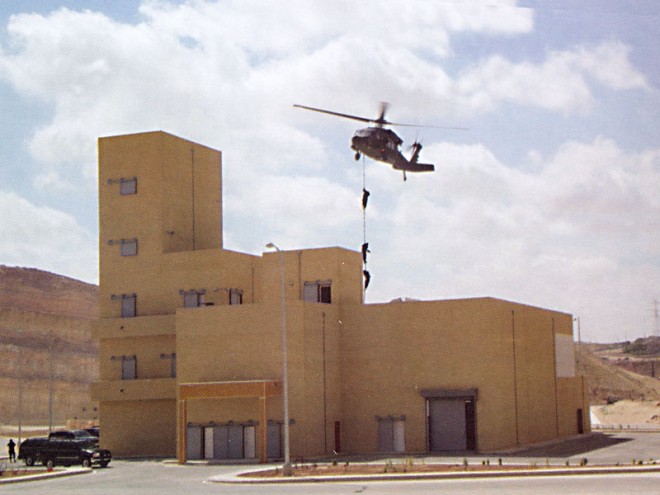 Military personnel conduct fast rope infiltration at KASOTC.