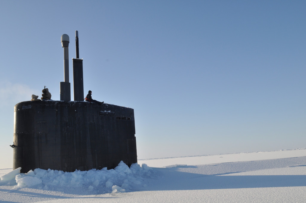 A Los Angeles class submarine surfaced through the thick ice in the North.
