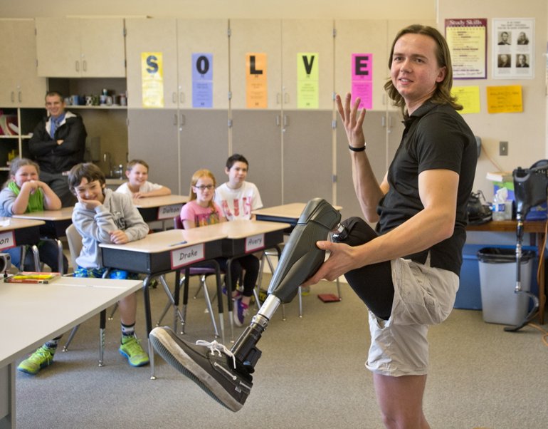 Edward Lychik talks to fifth- and sixth-graders at Maplewood Elementary School in Puyallup on April 9. (Peter Haley/AP)