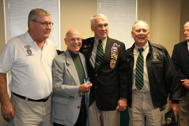From left: MACV-SOG Recon Team members stand with Pat Watkins, shortly after he received the Distinguished Service Cross for valor stemming from an August 23, 1968 NVA sapper attack that killed 17 Green Berets in a secret compound in Da Nang. The Recon Team members are Tony Herrell, of RT Louisiana, John E. Peters, of RT Rhode Island, Watkins, and Doug LeTourneau who ran missions with RT Idaho and RT Virginia. All four ran missions from FOB 1 in Phu Bai, S. Vietnam. Watkins served three tours of duty in SOG. On one mission in Laos, Watkins' team was so close to enemy forces, the NVA asked one of the members of his team, RT Lion, to stand for guard duty.
