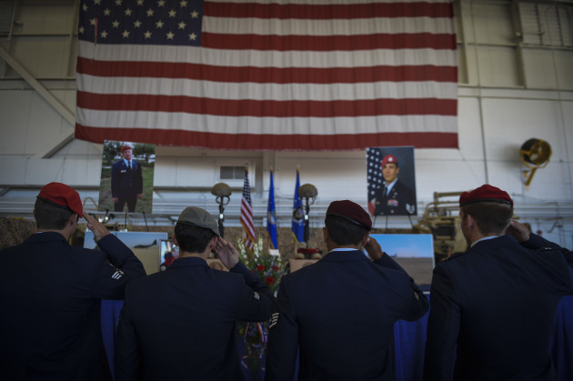 Airmen salute during Capt. Matthew D. Roland and Staff Sgt. Forrest B. Sibley’s memorial service,Sept. 14, 2015, at Hurlburt Field, Fla. More than 1000 friends and family members from across the country gathered together to mourn the loss of Capt. Matthew Roland, a special tactics officer from 23rd Special Tactics Squadron, and Staff Sgt. Forrest Sibley, a combat controller from the 21st Special Tactics Squadron, at the Freedom Hangar on Hurlburt Field, Fla., Sep. 14, 2015. The two Special Tactics Airmen, who had recently deployed to Afghanistan in support of Operation Freedom's Sentinel, were shot at a vehicle checkpoint at Camp Antonik, Afghanistan, Aug. 26, and died of wounds sustained in the attack, were honored in a private memorial. Both Special Tactics Airmen will be buried with full military honors. (U.S. Air Force photo by Senior Airman Ryan Conroy/Released)