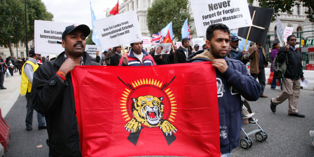 LONDON - OCTOBER 17: Demonstrators display a banner during a march by Tamils from the Embankment to Hyde Park on October 17, 2009 in London, England. The protest sought to highlight conditions in camps used to detain of civilians following the defeat earlier this year of the Tamil Tigers separatist movement by Sri Lankan government forces. (Photo by Rudy Cech/Barcroft Media/Getty Images)