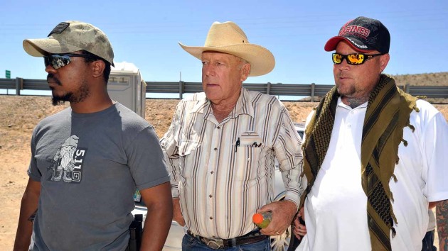 BUNKERVILLE, NV - APRIL 24: Rancher Cliven Bundy (C) arrives with body guards before a news conference near his ranch on April 24, 2014 in Bunkerville, Nevada. The Bureau of Land Management and Bundy have been locked in a dispute for a couple of decades over grazing rights on public lands. (Photo by David Becker/Getty Images)