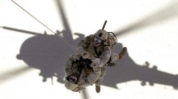 PJs winched up to a hovering chopper