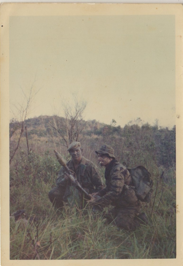 "That's me with the cigarette in my mouth---a bad habit fashionable at the time, and after the firing is over, lighting a smoke was not breaking stealth security. Just after the picture was taken, we noticed a bullet hole in the RPG warhead, and put it down gently, then blew it with C-4."