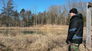 Ross Elder at Valhalla inspecting some of the permaculture features.