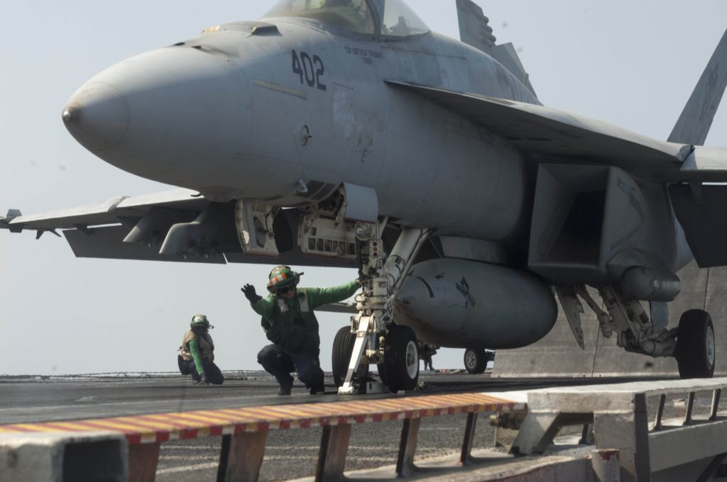 Aviation Boatswain's Mate (Equipment) 3rd Class Echeverria signals that an F/A-18E Super Hornet, assigned to the "Gunslingers" of Strike Fighter Squadron (VFA) 105, is ready for launch on the flight deck of the aircraft carrier USS Harry S. Truman (CVN 75). (U.S. Navy photo by Mass Communication Specialist 2nd Class Lyle H. Wilkie III/Released)