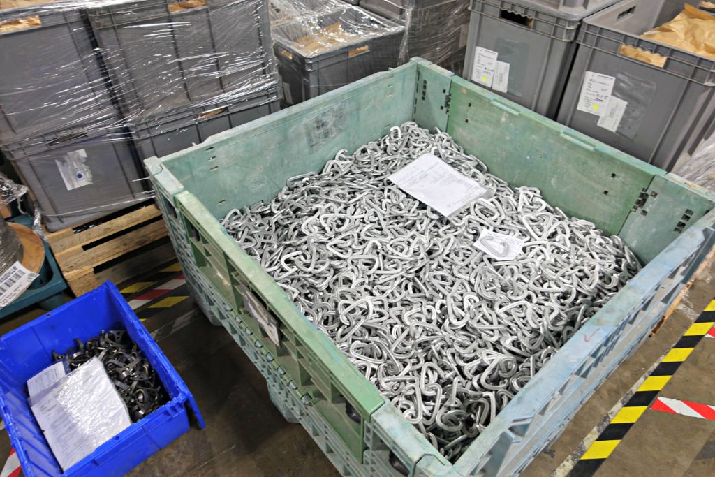 Pile of carabiners before gates are assembled and anodized.