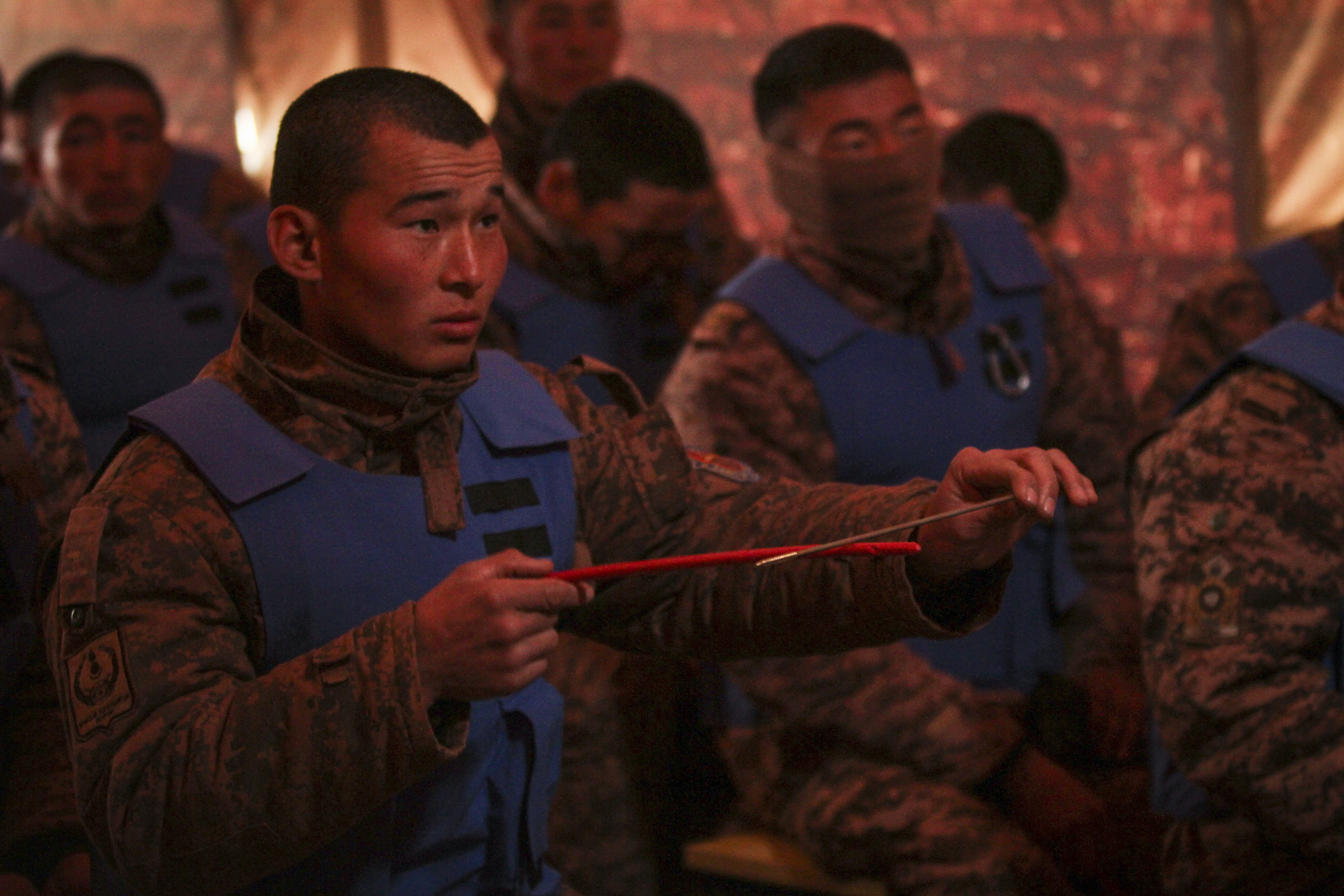 A Mongolian Armed Forces Soldier participates in minefield self-extraction training instructed by the U.S. and Canadian Army at Khaan Quest 2016, Five Hills Training Area, Mongolia, May 25, 2016. Khaan Quest is an annual, multinational peacekeeping operations exercise hosted by the Mongolian Armed Forces, co-sponsored by U.S. Pacific Command, and supported by U.S. Army Pacific and U.S. Marine Corps Forces, Pacific. Khaan Quest, in its 14th iteration, is the capstone exercise for this year’s Global Peace Operations Initiative program. The exercise focuses on training activities to enhance international interoperability, develop peacekeeping capabilities, build to mil-to-mil relationships, and enhance military readiness. (U.S. Marine Corps photo by Cpl. Hilda M. Becerra / Released)