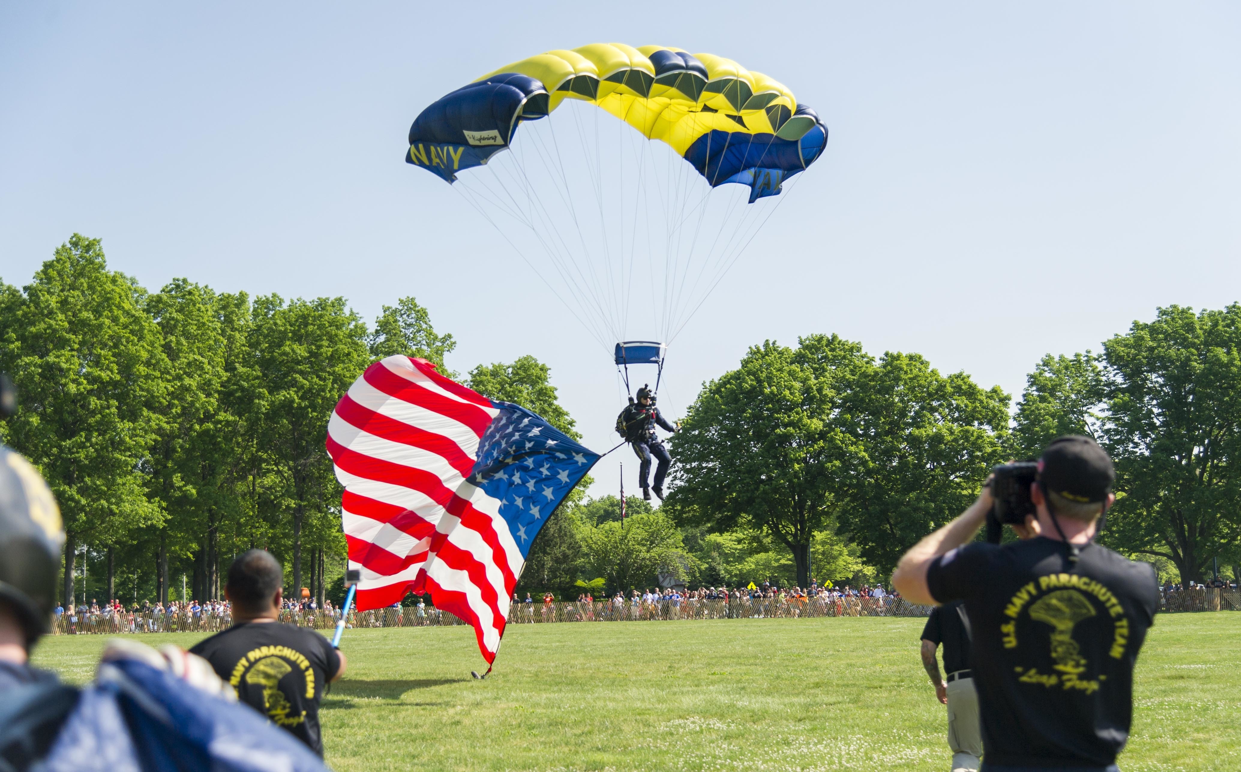 160528-N-SF508-152 EAST MEADOW, N.Y. (May 28, 2016) — A member of the Navy Parachute Team, the Leap Frogs, parachutes into Eisenhower Park in East Meadow, N.Y. during an aviation demonstration and static display as part of 2016 Fleet Week New York, May 28. FWNY, now in its 28th year, is the city's time-honored celebration of the sea series. It is an unparalleled opportunity for the citizens of New York and the surrounding tri-state area to meet Sailors, Marines and Coast Guardsmen, as well as witness firsthand the latest capabilities of today's maritime service. The weeklong celebration has been held nearly every year since 1984. (U.S. Navy photo by Mass Communication Specialist 2nd Class Charles Oki/Released)