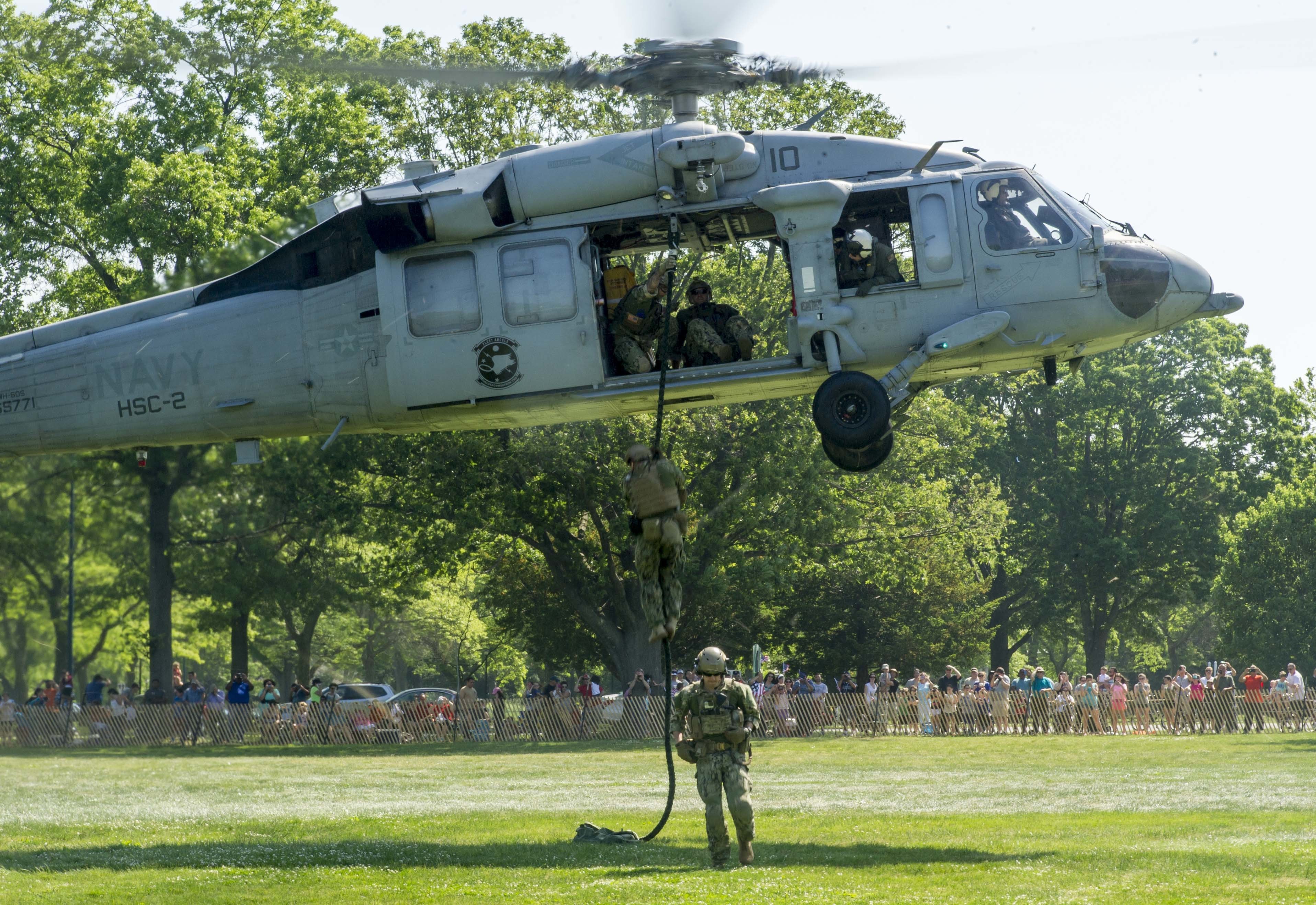 160528-N-SF508-262 EAST MEADOW, N.Y. (May 28, 2016) — Explosive Ordnance Disposal (EOD) Technicians, assigned to EOD Mobile Unit 12, fast rope during an aviation demonstration and static display at Eisenhower Park in East Meadow, N.Y. as part of 2016 Fleet Week New York (FWNY), May 28. FWNY, now in its 28th year, is the city's time-honored celebration of the sea series. It is an unparalleled opportunity for the citizens of New York and the surrounding tri-state area to meet Sailors, Marines and Coast Guardsmen, as well as witness firsthand the latest capabilities of today's maritime service. The weeklong celebration has been held nearly every year since 1984. (U.S. Navy photo by Mass Communication Specialist 2nd Class Charles Oki/Released)