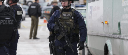 Federal officer arrested in fatal shooting of wife and two others