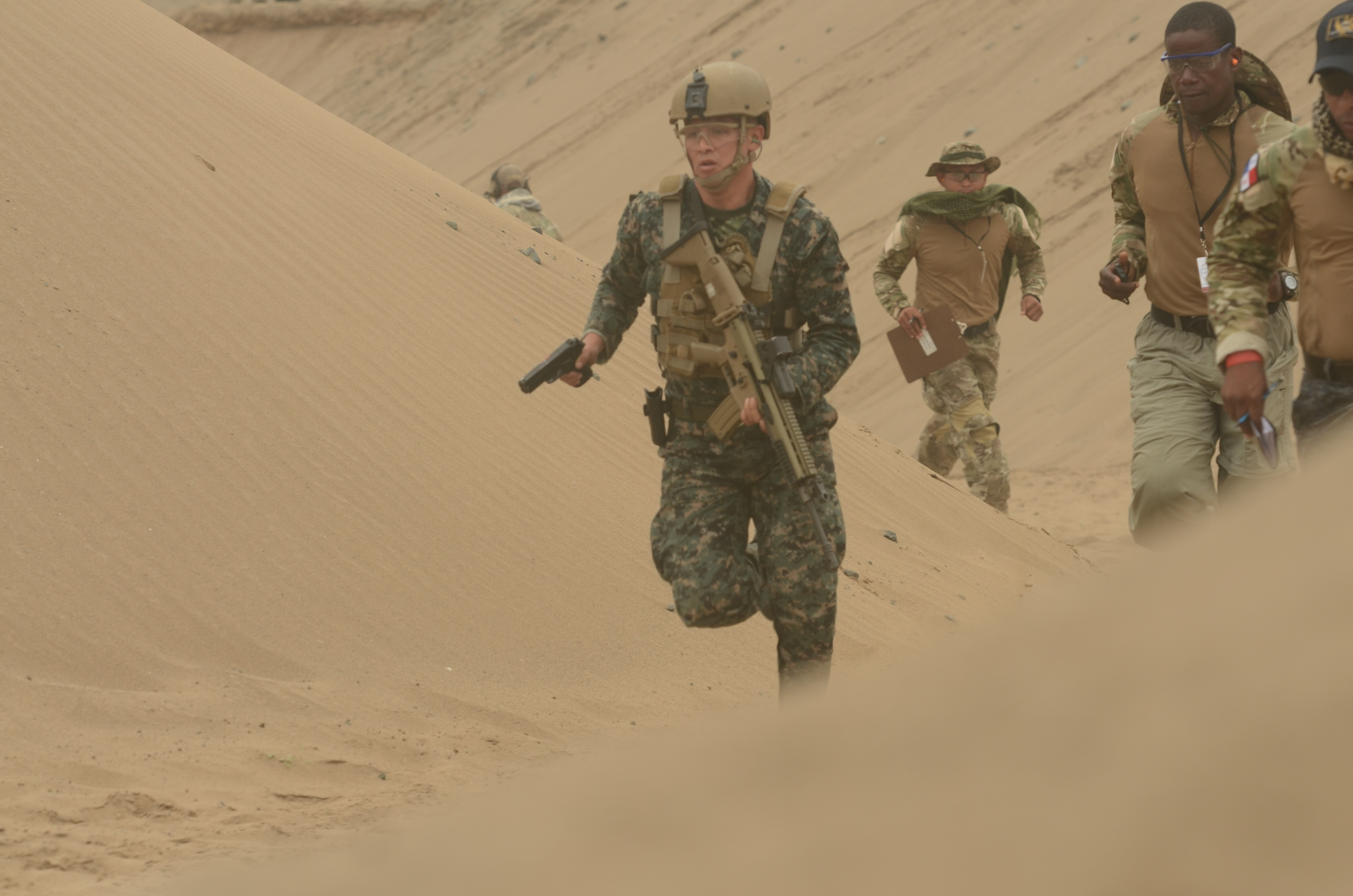 A member of Team Peru moves from one firing range to another during an assault team event as part of Fuerzas Comando 2016, May 3, 2016 in Ancon, Peru. Fuerzas Comando is a U.S. Southern Command sponsored exercise, in which 20 countries from North, Central and South America and the Caribbean compete in friendly special operation games. (U.S. Army Photo by Sgt. Eric Roberts/Released)