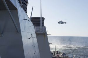  A Russian Kamov KA-27 HELIX flies low-level passes near the Arleigh Burke-class guided missile destroyer USS Donald Cook (DDG 75) while the ship was operating in international waters. (U.S. Navy photo/Released)