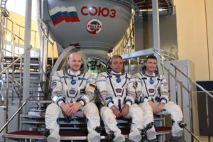 At the Gagarin Cosmonaut Training Center in Star City, Russia, Expedition 38/39 backup crewmembers Flight Engineer Alexander Gerst of the European Space Agency (left), Soyuz Commander Max Suraev (center) and NASA Flight Engineer Reid Wiseman (right) pose for pictures in front of a Soyuz simulator,NASA/Stephanie Stoll