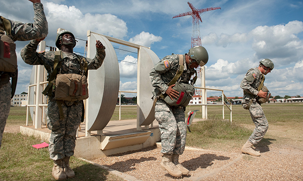 Recruits practice their airplane exit, maneuvering and landing while on the ground. Army photo by Patrick Albright.