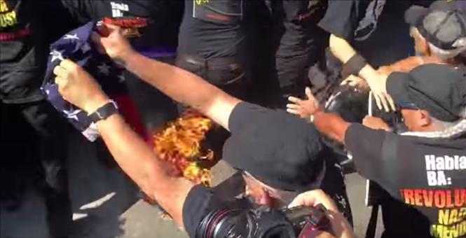 Watch: ‘You’re on fire, stupid.’  Man ignites himself while burning American flag outside RNC