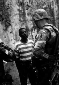 Special Forces Soldier chatting with Haitian