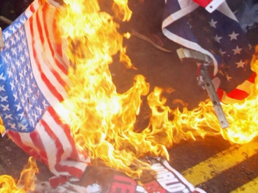 Police arrest protesters at flag-burning outside convention