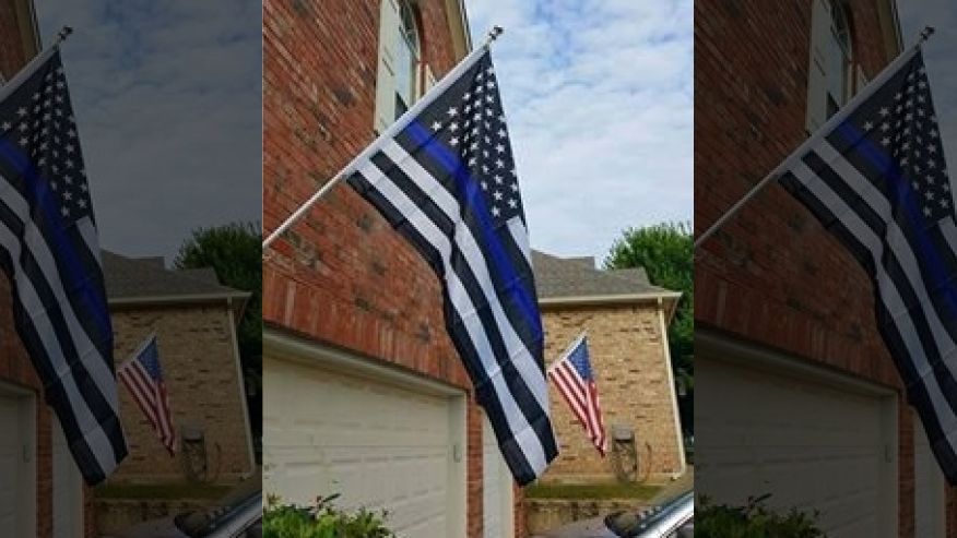 Homeowner told to remove “noxious & offensive” pro-police flag