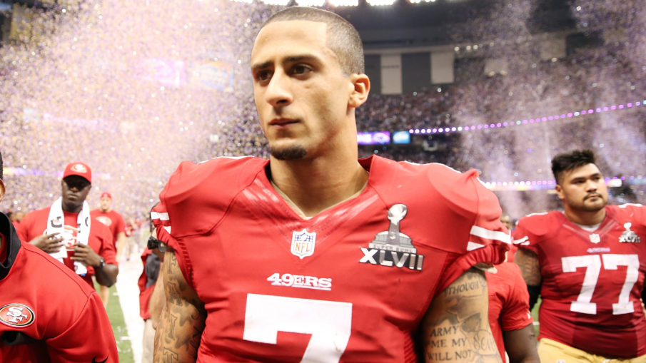 Niners QB Kaepernick refuses to stand for anthem in protest