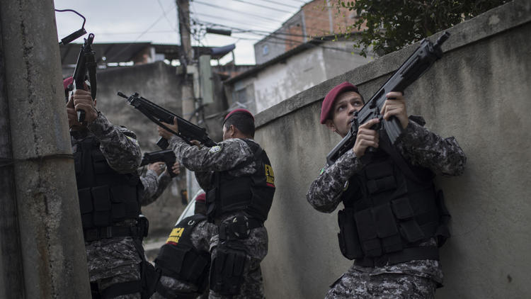 Olympic security officer shot in the head after wrong turn into slum