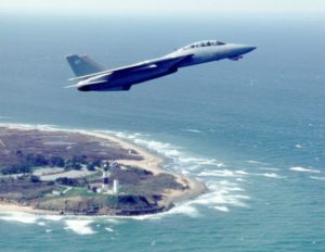 An F-14D over Montauk Lighthouse (Grummanpark.org)