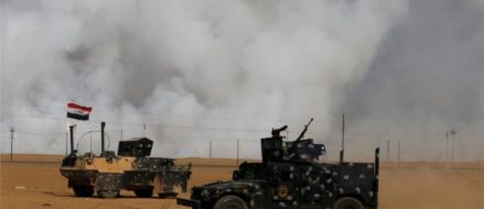 US Troops mask up against toxic fumes in Iraq