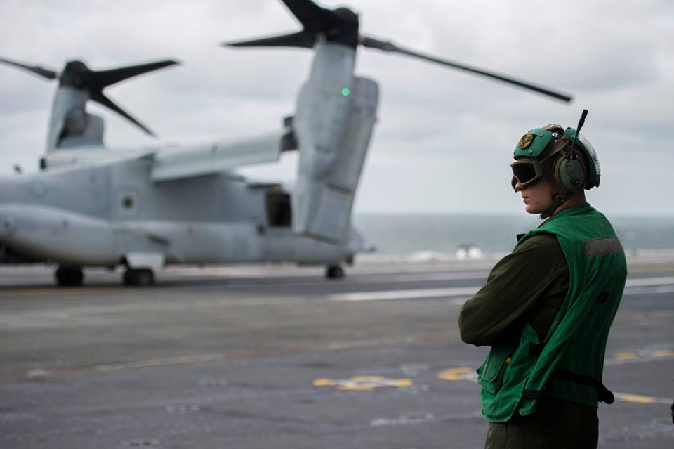 Cpl. Nicholas Beattie prepares to unload a MV-22B Osprey transport aircraft assigned to Marine Medium Tiltrotor Squadron (VMM) 365 aboard the aircraft carrier USS George Washington (CVN73). George Washington, homeported in Norfolk, is underway in the Atlantic Ocean. (U.S. Navy photo by Seaman Jonathan Price)