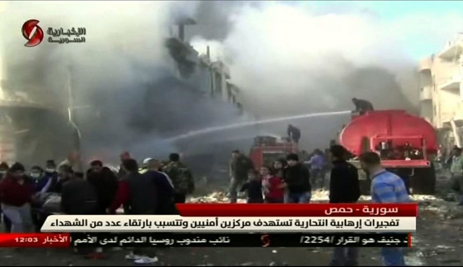 Blasts in Syria kill dozens at security headquarters in Homs