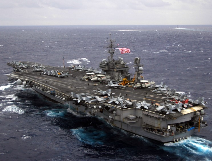 Watch: Pitching Deck! Waves Over the Bow of the USS Kitty Hawk!
