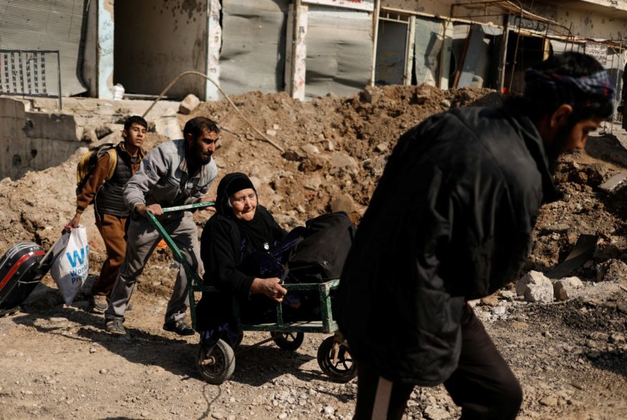 U.S.-backed Iraqi forces capture Mosul bridge, close in on state buildings