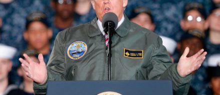 Trump talks tough on defense spending aboard the world’s most advanced combat ship