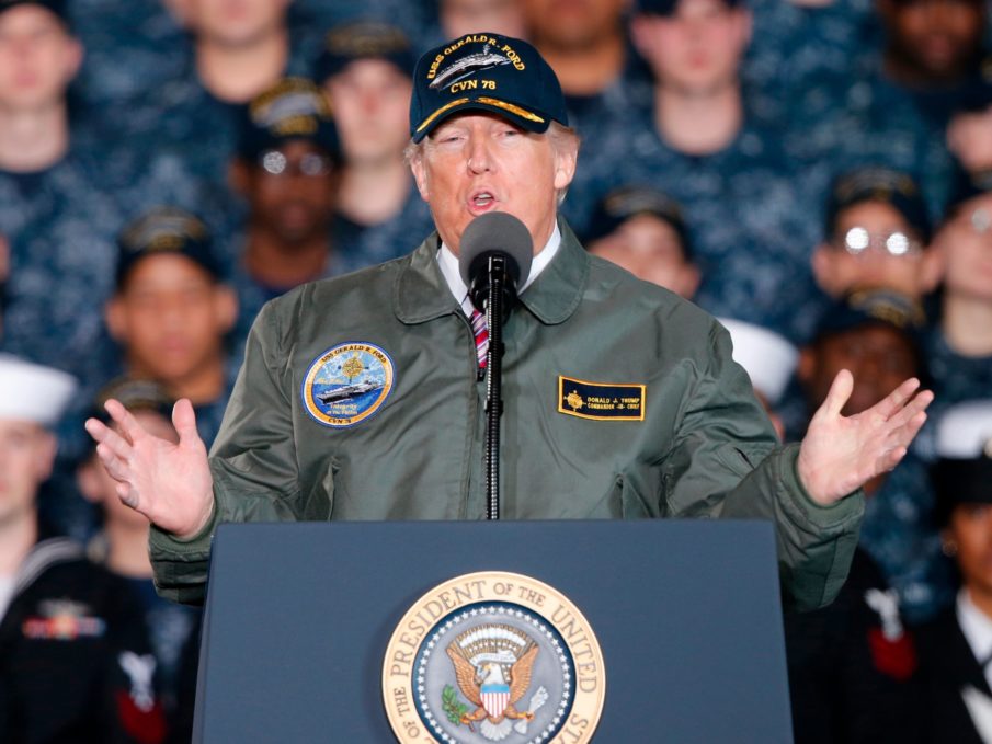Trump talks tough on defense spending aboard the world’s most advanced combat ship