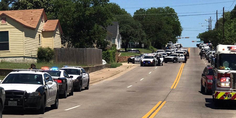 One paramedic, one civilian shot in Dallas. Police surround barricaded shooter