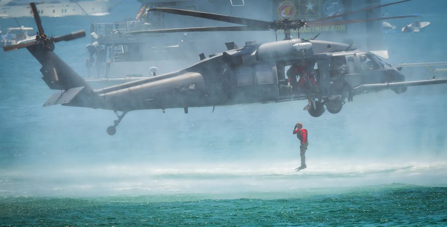 Picture of the Day: Air Force Pararescueman Enters Water from HH-60G Pave Hawk