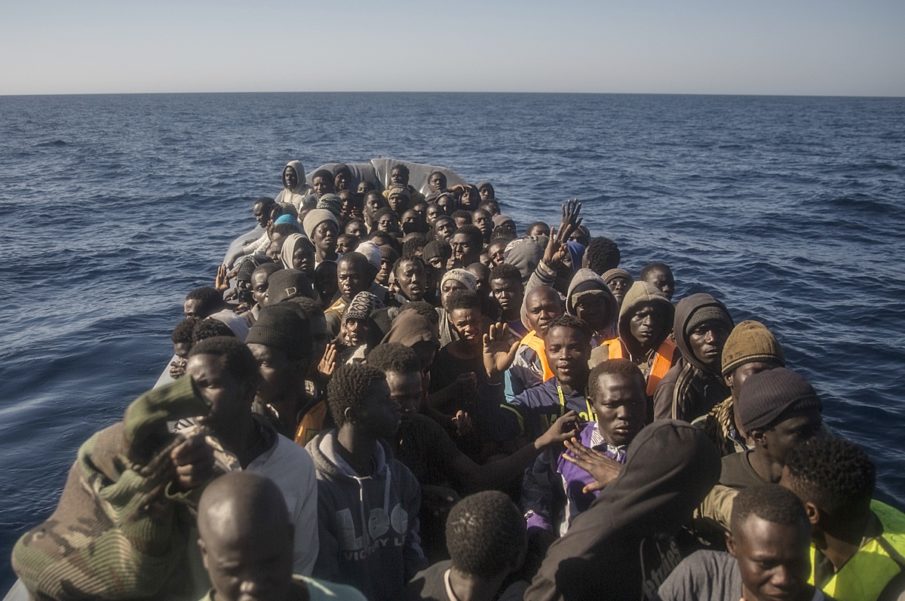 At least 50 migrants drown as smuggler throws them into the sea