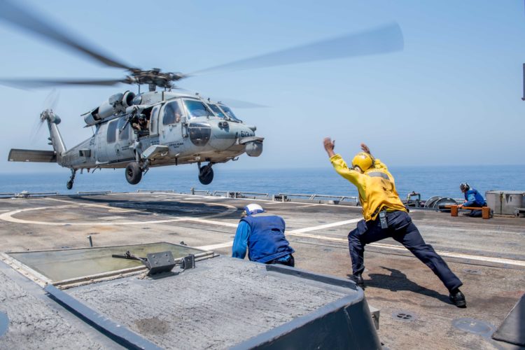 Picture of the Day: MH-60S Sea Hawk Helicopter Departing the USS Princeton CG 59