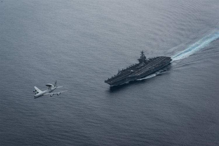 Picture of the Day: Air Force E-3 Flies Over the USS Theodore Roosevelt CVN 71