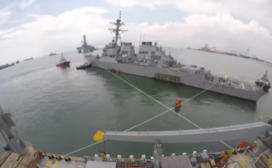 Watch: Damaged USS John S. McCain loaded onto heavy transport ship for repairs