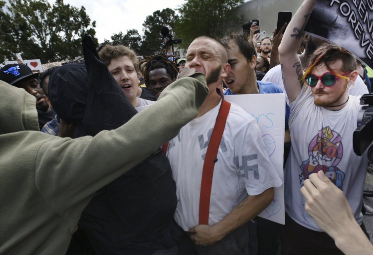 A black protester hugged a white nationalist outside Richard Spencer’s talk. ‘Why do you hate me?’ he asked