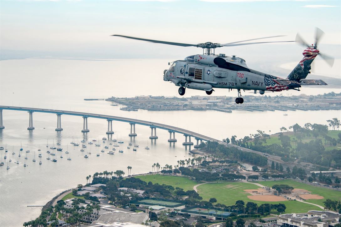 Navy Seahawk helicopter flies over San Diego during a training exercise Maritime Strike Squadron 78