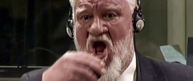 Convicted War Criminal Dies After Drinking Poison in Court