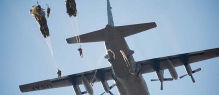 Army paratroopers exit from C-130 Hercules for the Randy Oler Memorial Operation Toy Drop