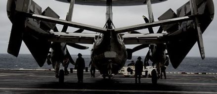 Sailors prepare to move E-2D Hawkeye VAW 120 & Hawkeye Ball