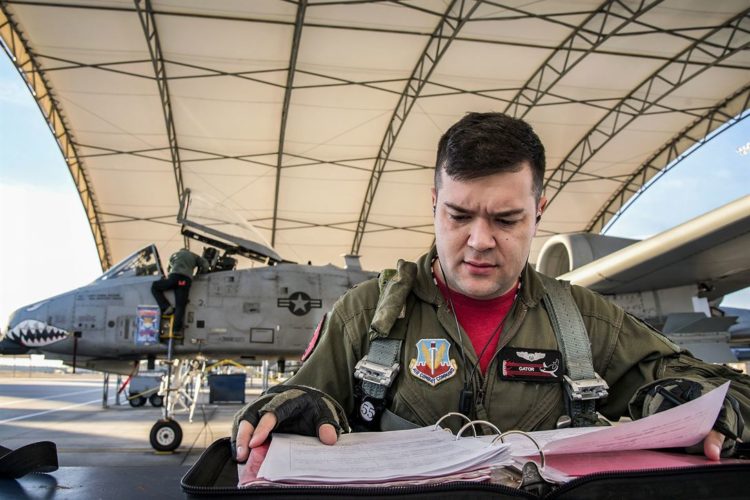 Picture of the Day: Air Force Capt. Haden Fullam 75th Fighter Squadron Pilot Readies His Flight Plan