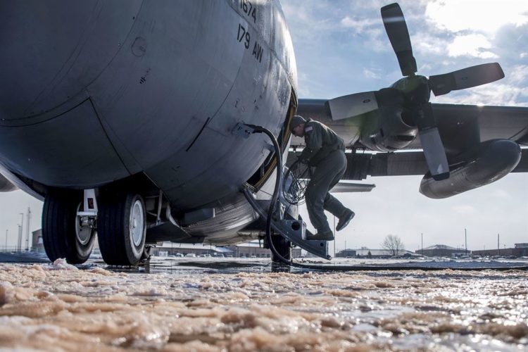 Picture of the Day: Air Force Tech. Sgt. Chris Brandal Inspects a C-130H Hercules in Bitter Cold
