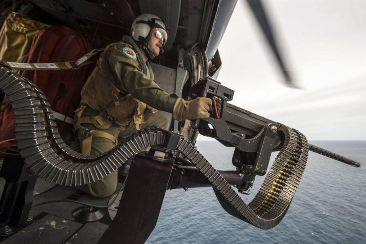 Picture of the Day: Navy Petty Officer 2nd Class Nicholas Lovelace and his .50-caliber Machine Gun