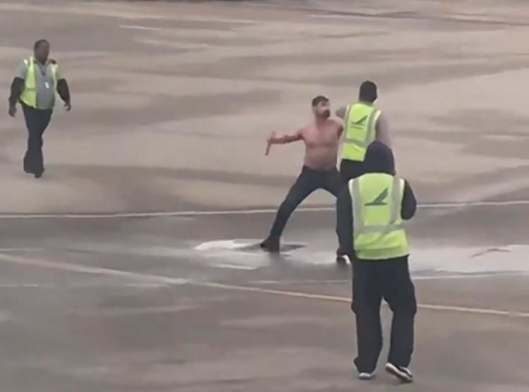 Watch: Shirtless Passenger Tries to Fight Tarmac Workers at Charlotte Airport
